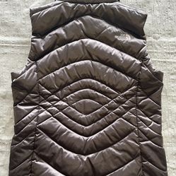 North Face Aconcagua 550 down puffer vest in a dark gray/bronze color.. Sz Medium Women’s.Located west roseville..