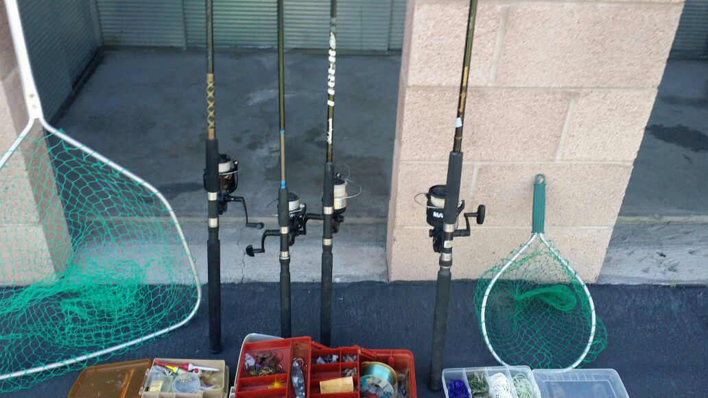 Four medium to medium large spinning rods and reels, three boxes of tackle and two fishing nets