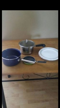 Kitchen pots, pan, and plates.