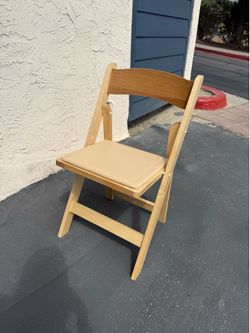 8 light wood folding chairs