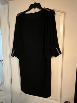Women black dress size 6  has rhinestones at sleeves and shoulders, stretch material
