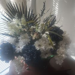 A Glass Vase With All Sorted Flowers
