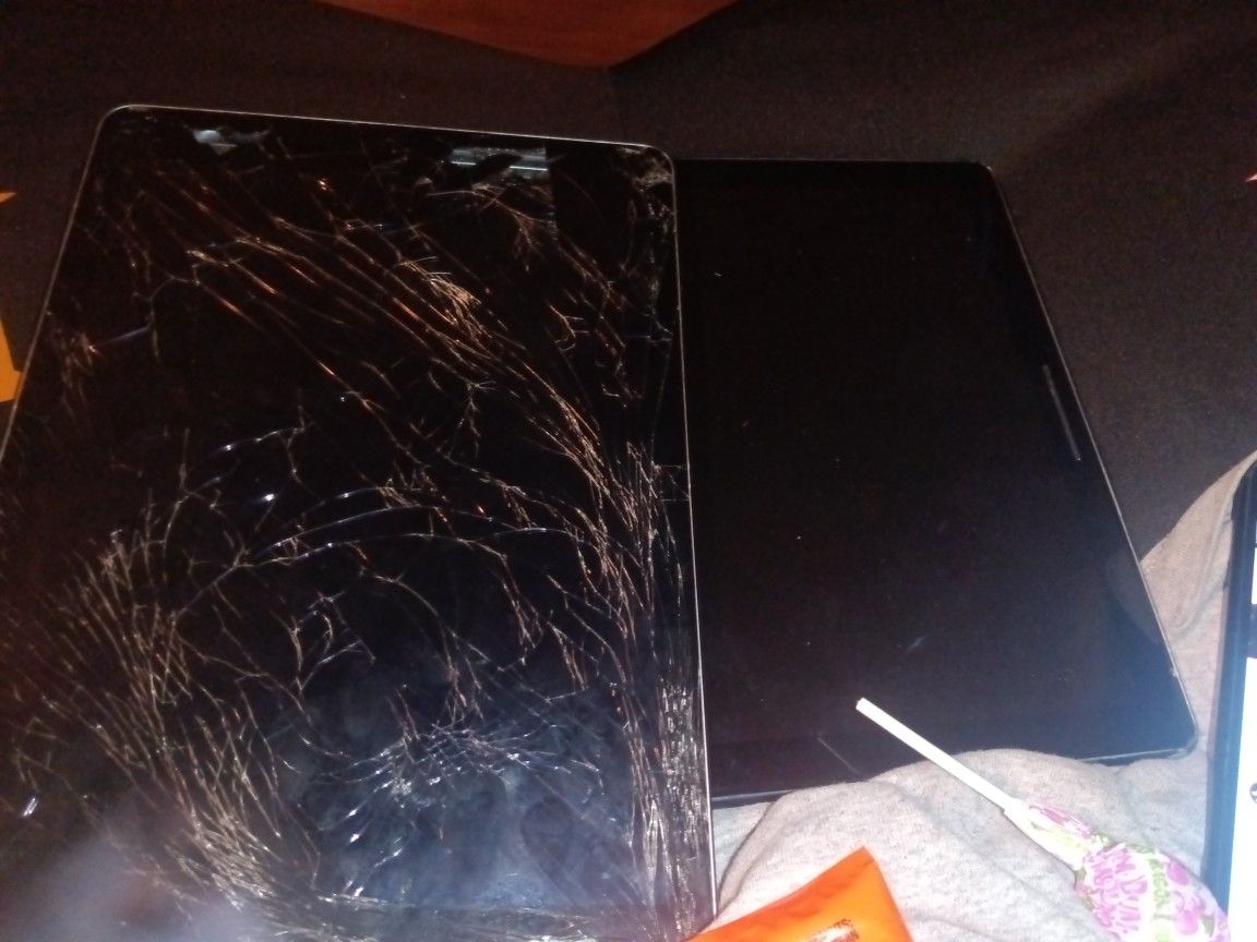 Broken Apple iPad . And Google Tablet 