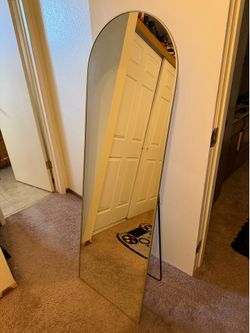 full-length arched floor mirror