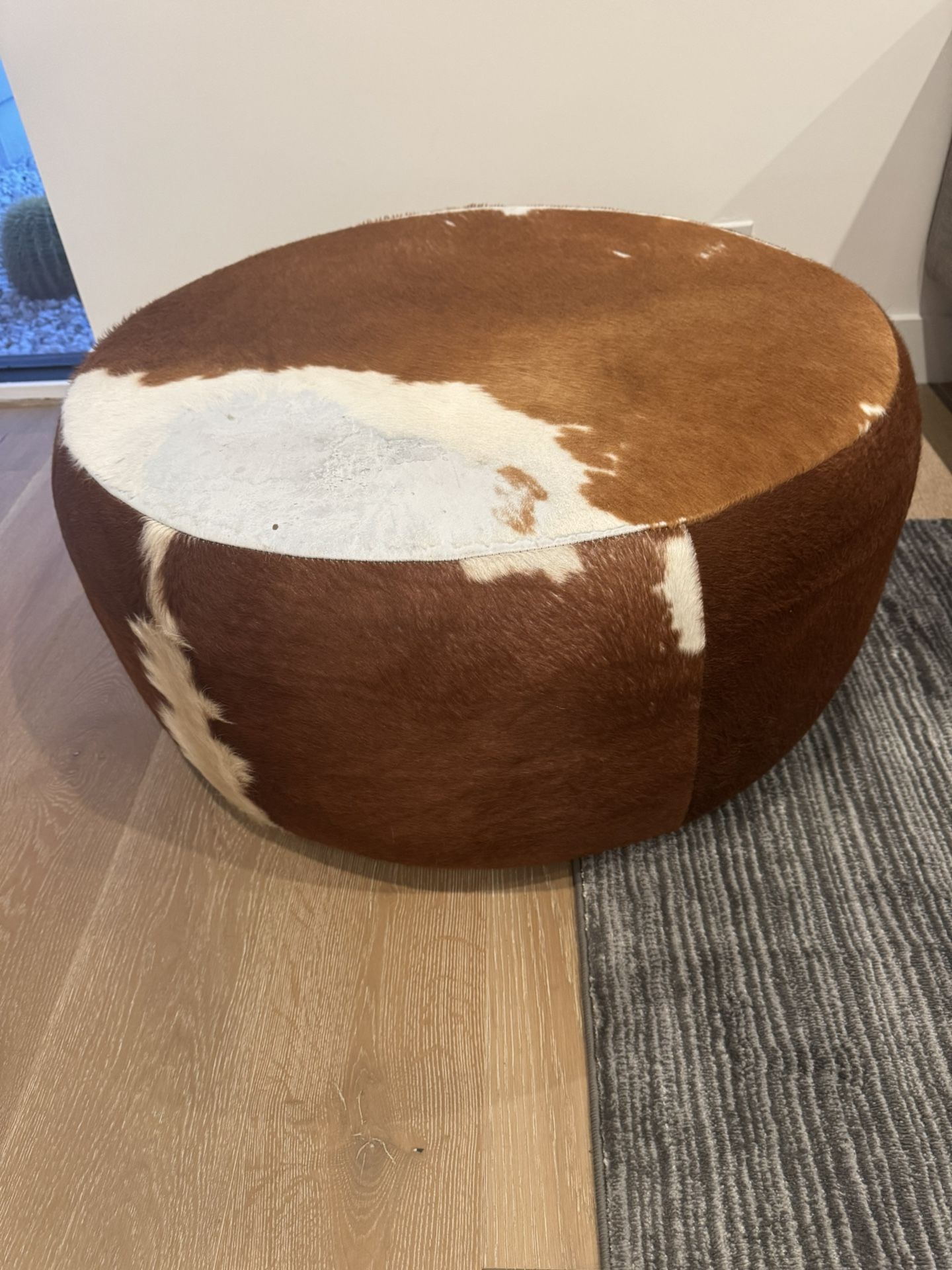 Cowhide ottoman 32” $100