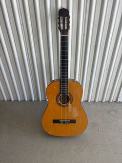 Used acoustic guitar