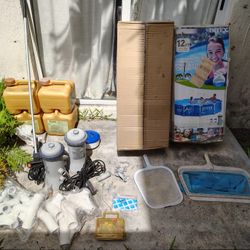 Intex 12 Ft Pool With Unused Ladder,  2 Pumps, 4 Chlorine Bottles Used, Normal Wear