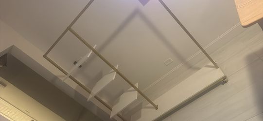 Portable clothing rack with shelves