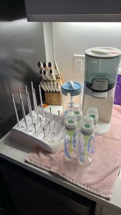 3 Glass bottles, 1 plastic bottle, water warmer, formula mixer & bottle drying rack