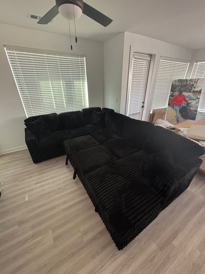 BRAND NEW LARGE BLACK CORDUROY SECTIONAL WITH STORAGE AND PULL-OUT BED
