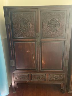 Antique and one vintage cabinets