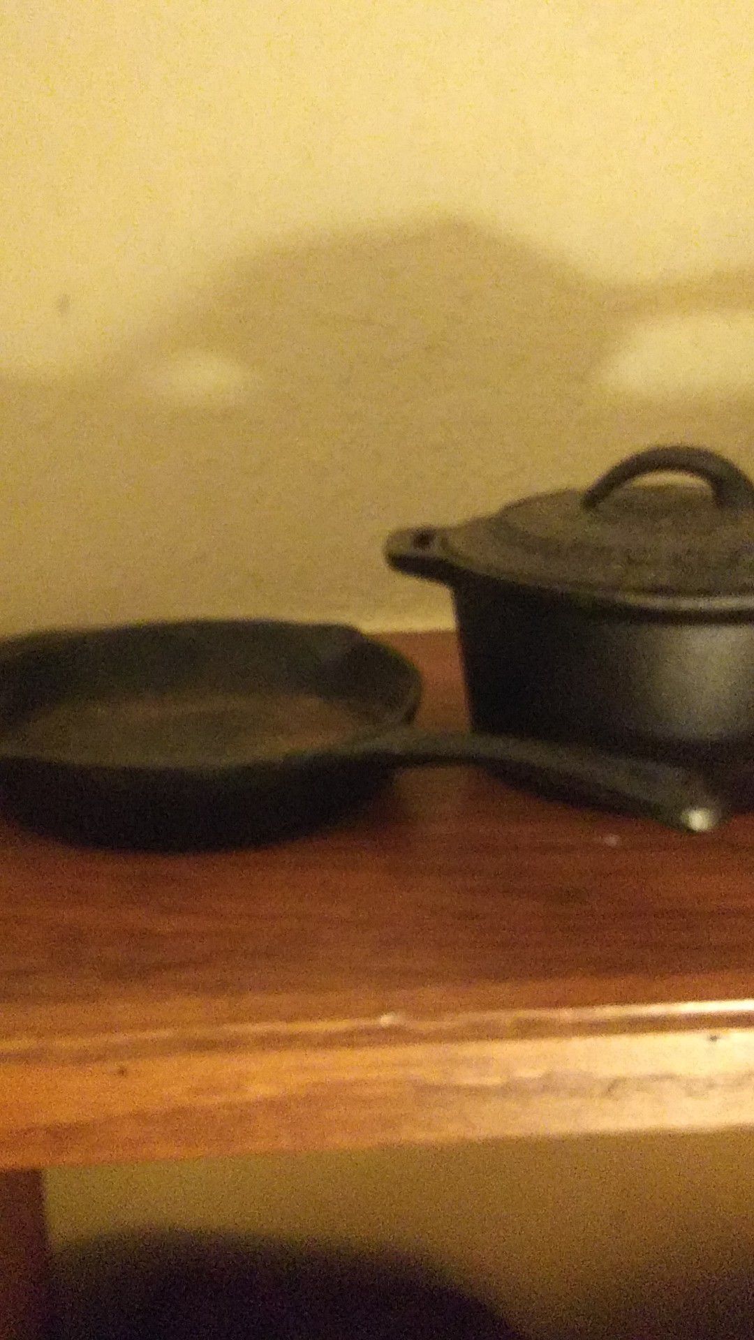 John Wayne Cast Iron sauce pot w/ lid, and 6in. Cast iron skillet.