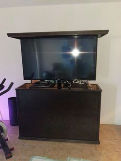 TV with remote TV stand. Hi quality over $4 K new