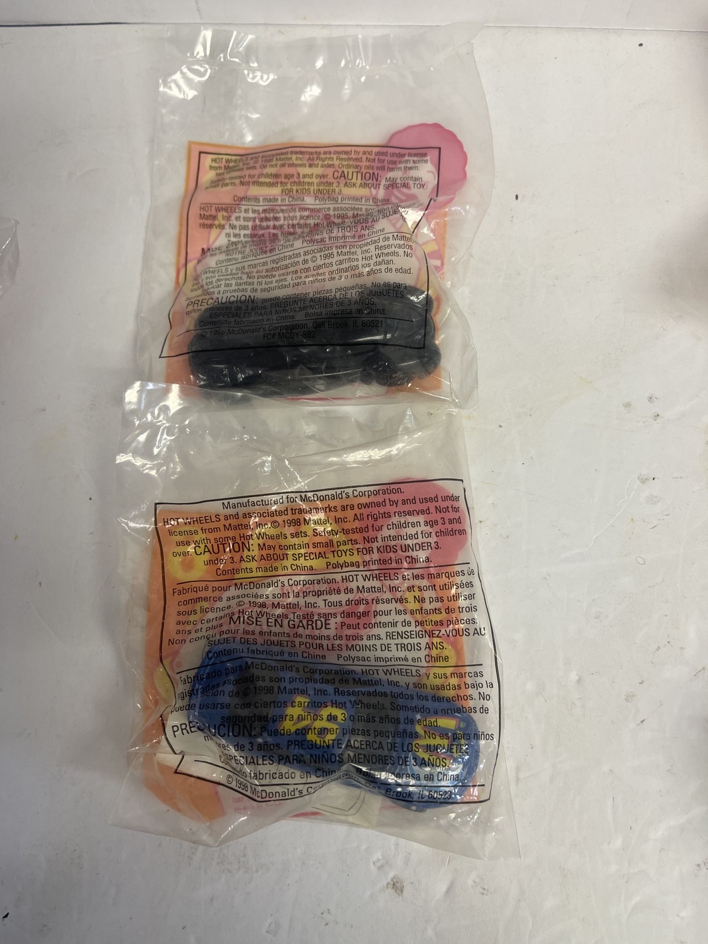  F205 - Hot Wheels 1995 McDONALDS set of 2 in unopened original package.