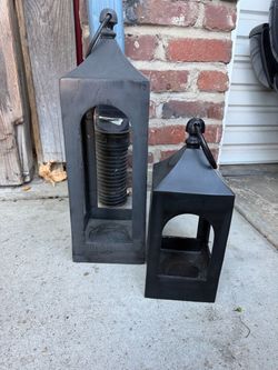 Two metal garden lanterns