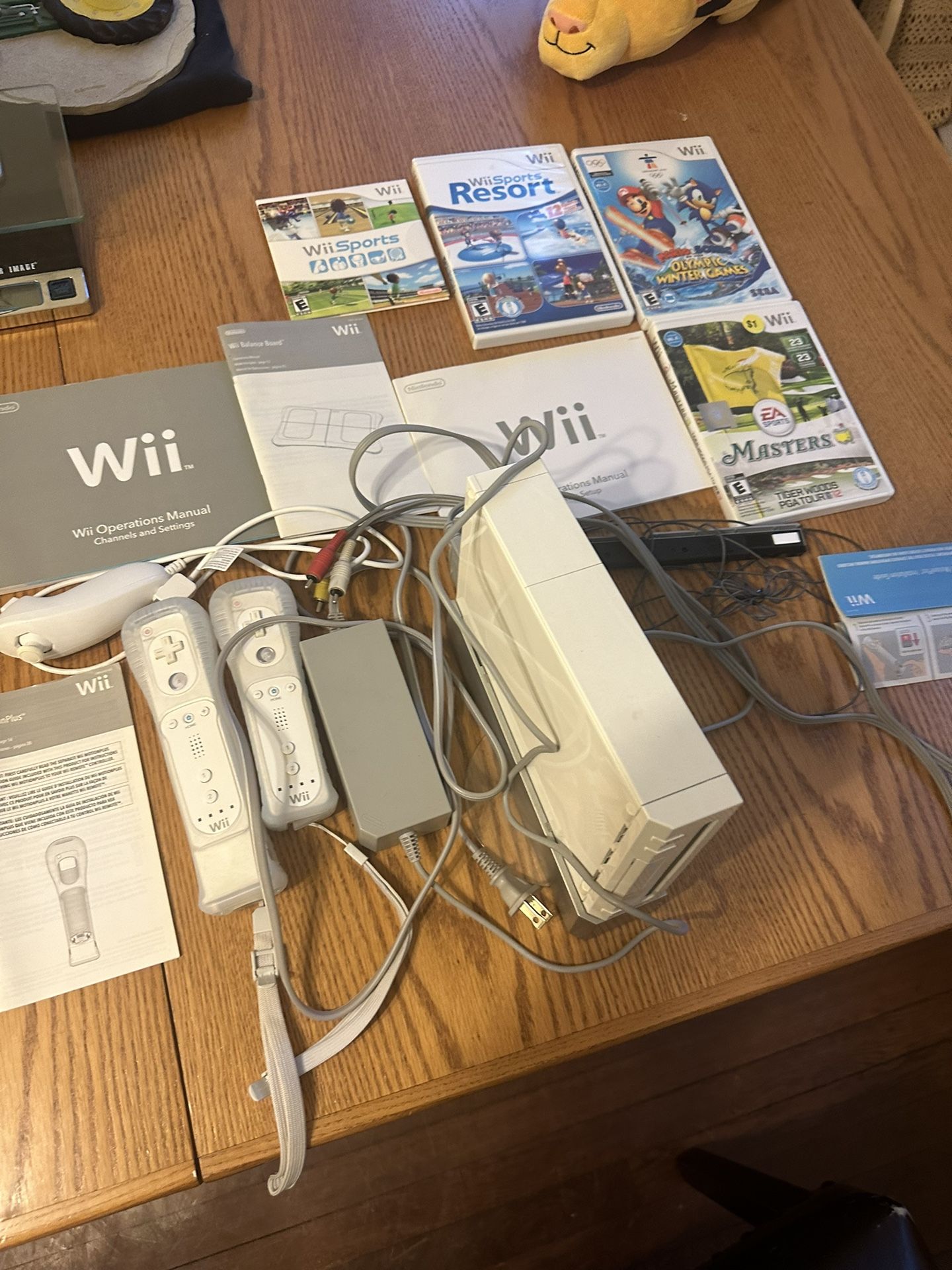 Nintendo Wii RVL-001 Home Console Large Bundle With 2 Remotes,4 games,wii sports,Wii resort,Mario olympic winter games,Masters everything in the pict