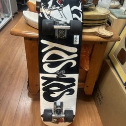 Skateboard with a custom black and white design