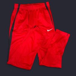 Red Nike Dri-Fit track pants