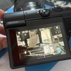 Canon M100, 14-45 lens, charger
