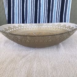 Glass oval bowl with a beautiful gold design,