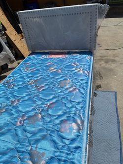 BRAND NEW TWIN SIZE BED INCLUDING HEADBOARD AND FRAME AND MATTRESS