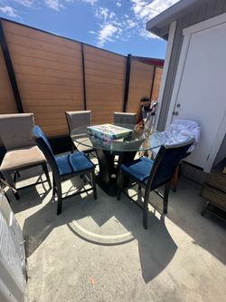 Modern round glass top table with 6 chairs