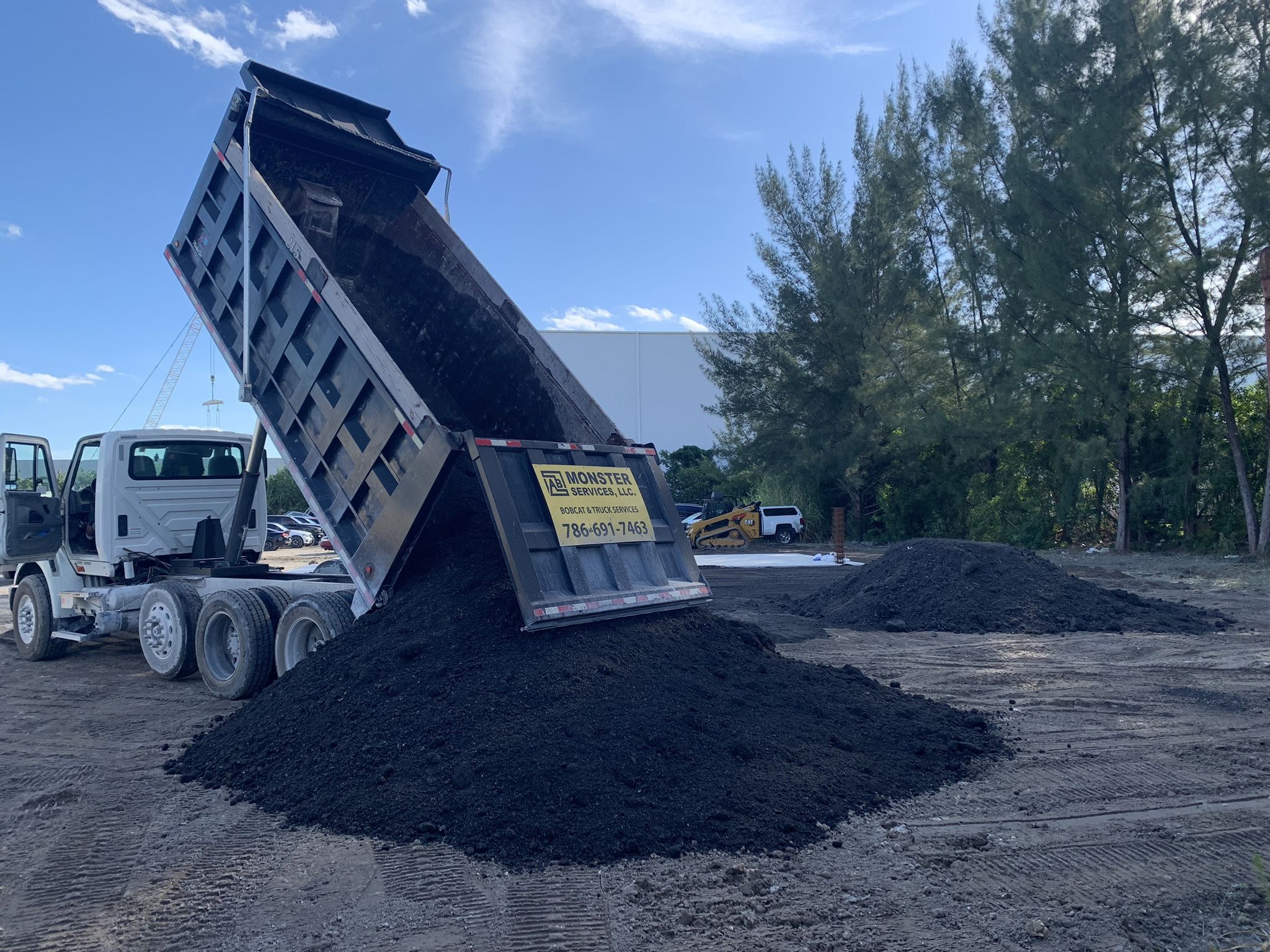 Dump Truck And Skid Steer / Bobcat