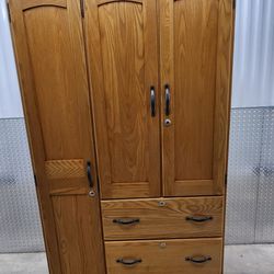 Brush up your bedroom with this classic Practical and excellent condition wardrobe closet with drawers shelves hanging rod and locks. Its classic colo