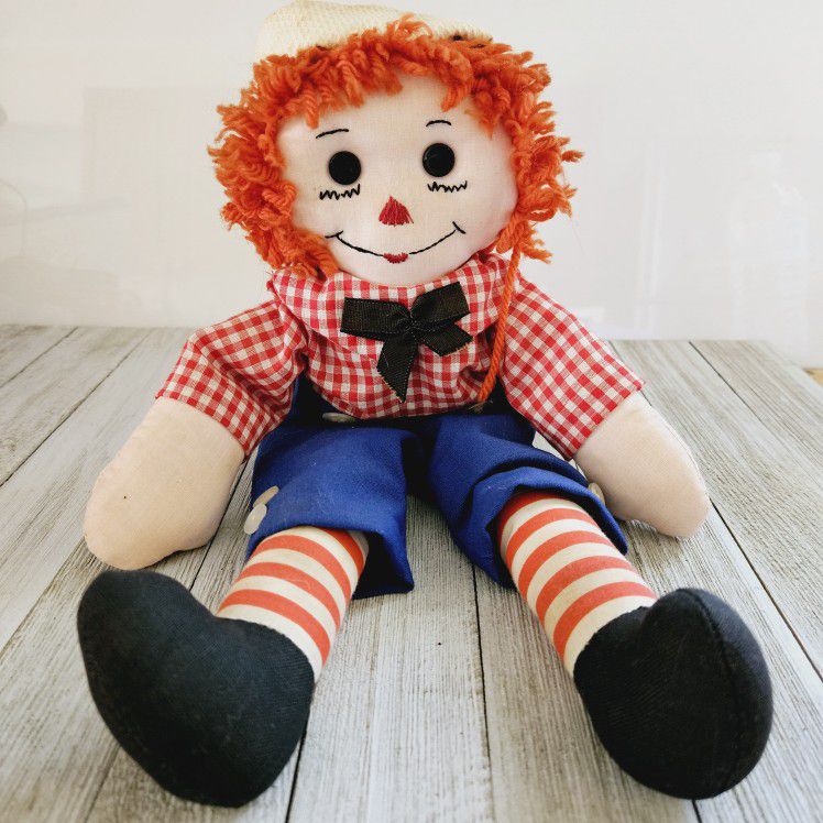 Vintage 15" Raggedy Andy Plushie Doll with an Embroidered Face and I Love You Heart on His Chest. No tags or brand name. 

Pre-owned in excellent clea