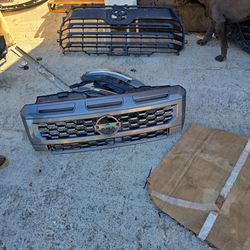 2025 Nissan Frontier Front Bumper Upper Grille w/Sight Shield OEM 62310-9BY1D