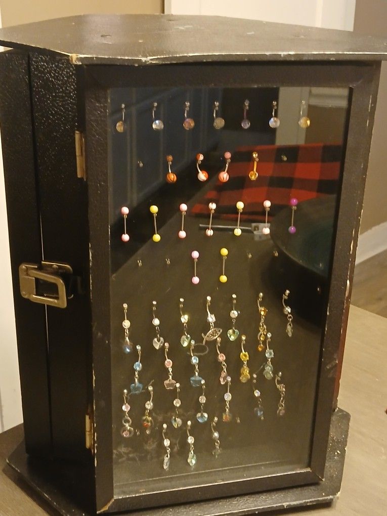 Turn-Style Glass Display Case With Body Jewelry