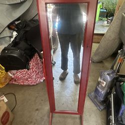 Mirror w/ jewelry storage cabinet.