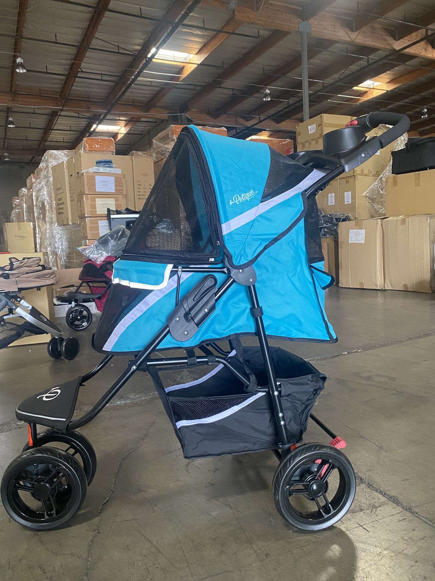 Petique revolutionary pet stroller in teal blue for dogs, cats and small animals up to 55 pounds