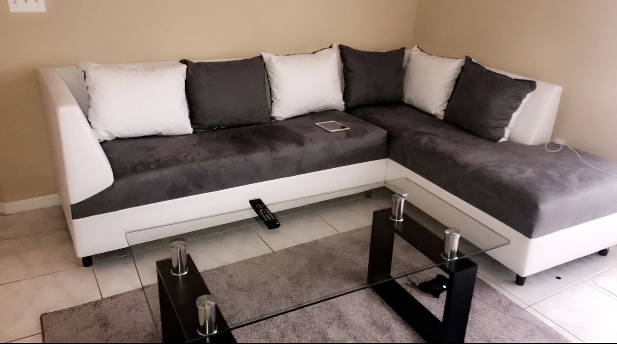 2 piece sectional with glass table