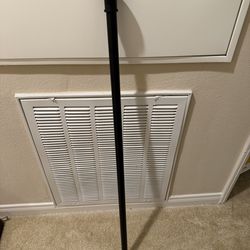 Black adjustable shower rod