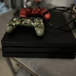 PS4 PRO WITH GAMES AND CONTROLLERS 
