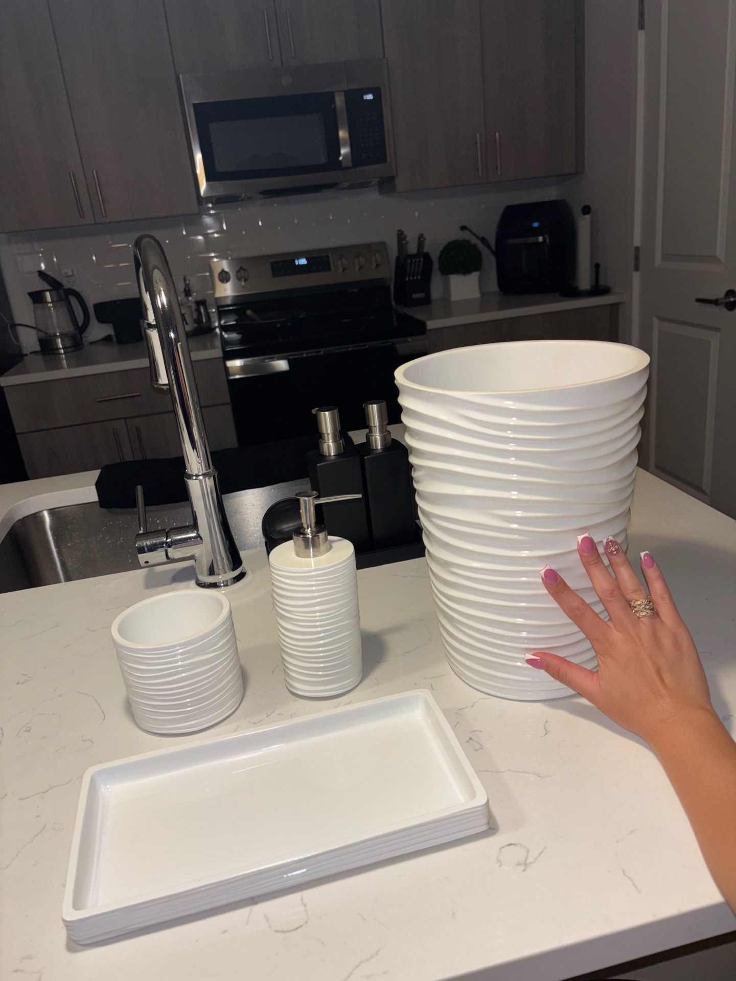 White bathroom set; trash can, canister, vanity tray, & soap dispenser