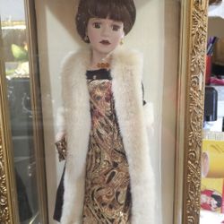 Porcelain Doll In Display Case
