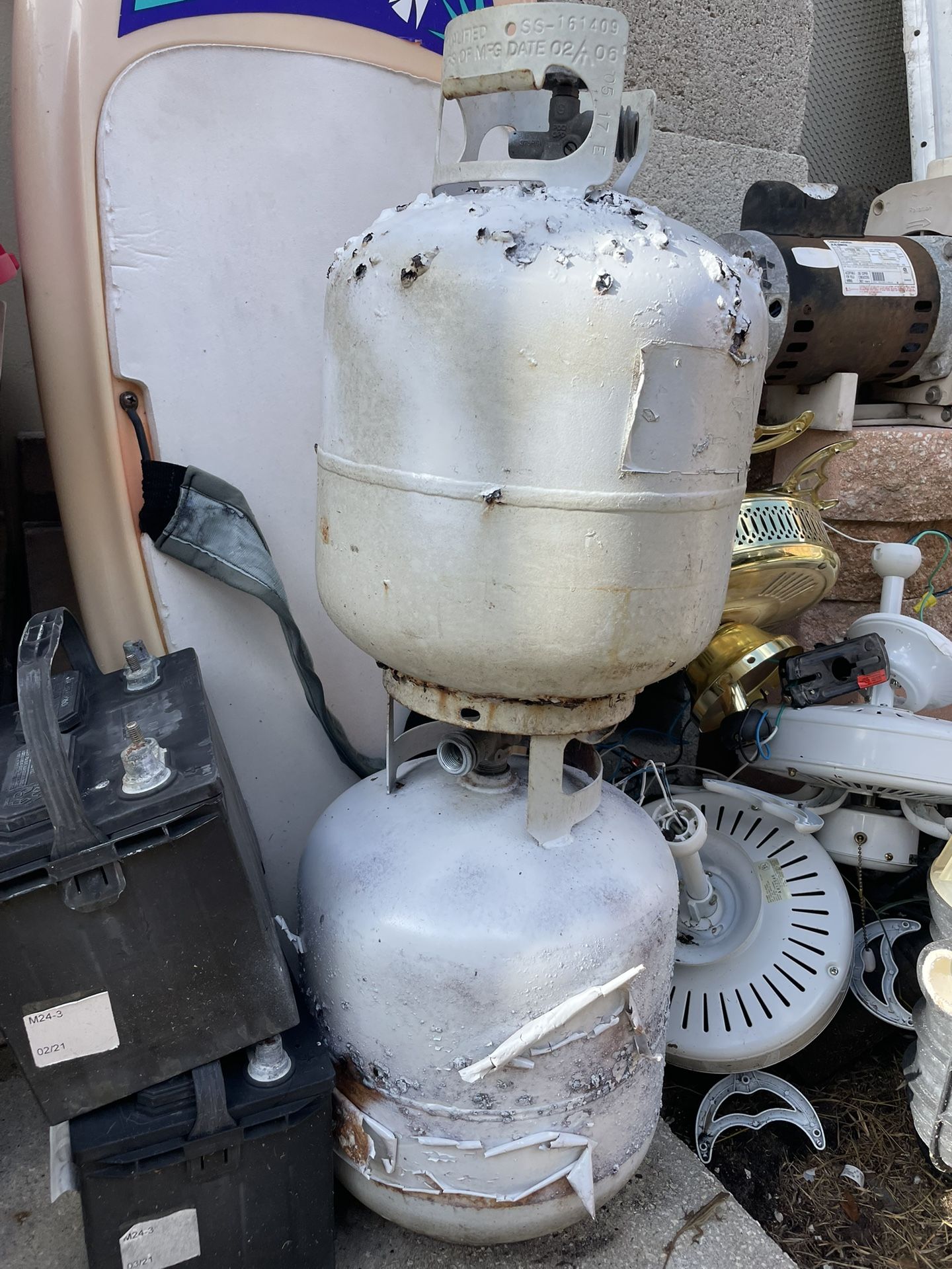2 propane tanks one has gas. The other is empty good for exchange at Walmart $10 each.