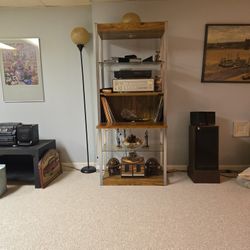 Entertainment stand with four shelves and a record compartment