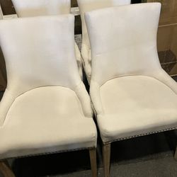 Set If 4 New Pacific Direct Beige/Cream Wingback Dining Chairs W/Some Dirt(Been In Storage)(See & Click On Pictures). Still In Very Good Condition 