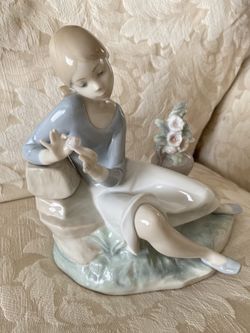 Lladro Nostalgia Girl w/Flowers Glossy Porcelain. Was$350. Now… $105