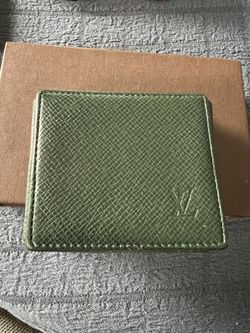 LV taiga Leather coin pouch 