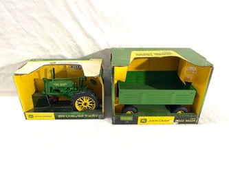 Made in USA by ERTL. Scale 1/16 diecast toy, John Deere farm tractor and John Deere trailer. Total retail is $110.