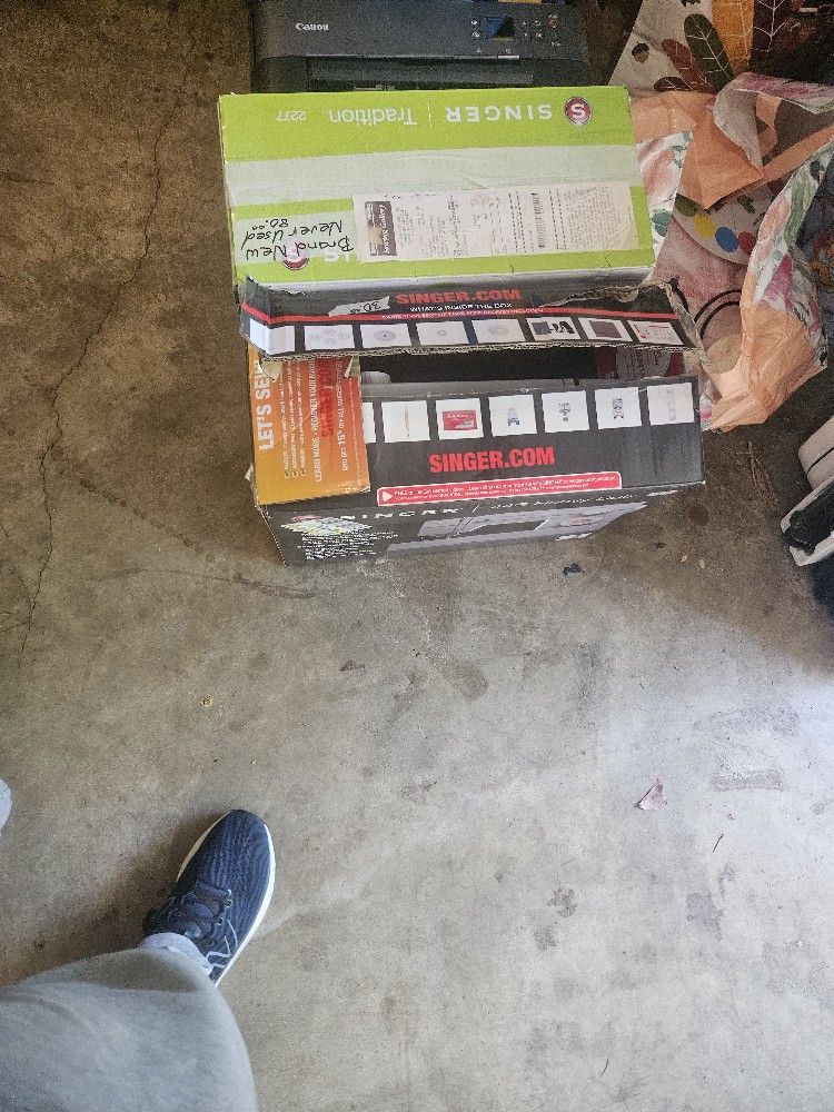 Two Sewing Machines One Used, One Brand New