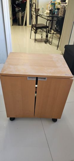 multifunctional folding mobile cabinet, Mobile storage unit/small cabinet on wheels from IKEA, model Motiv, nicely used. Frame in white with doors and