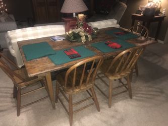 Antique/Primitive dining table with chairs. Measures approximate 40 x 72 inches.