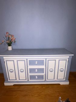vintage-style wooden credenza or sideboard that has been custom-painted