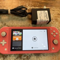 Coral Nintendo Switch Lite Handheld System (Some Wear) Chip Top Left Corner Includes Charger 