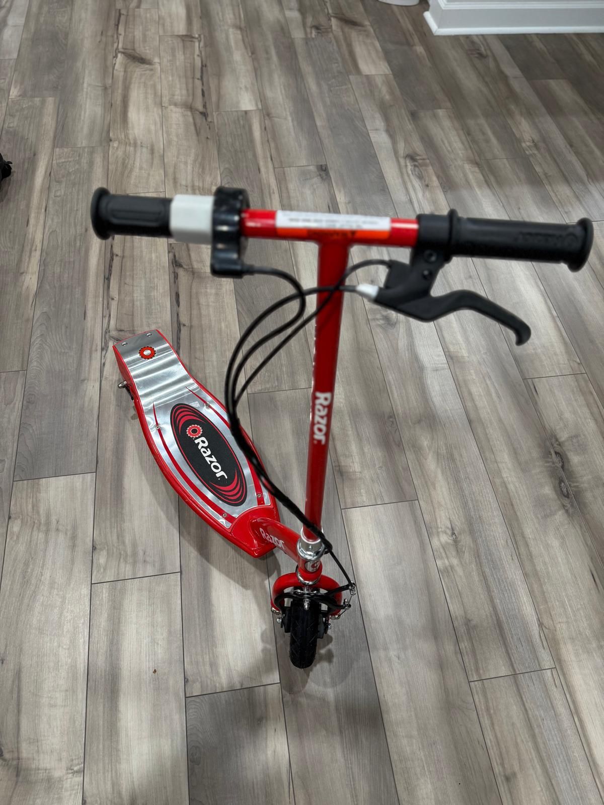 Razor E100 Kids Ride On 24V Motorized Battery Powered Electric Scooter Toy with up to 10 MPH Speed and 8 Inch Pneumatic Tires for Ages 8 Above, Red